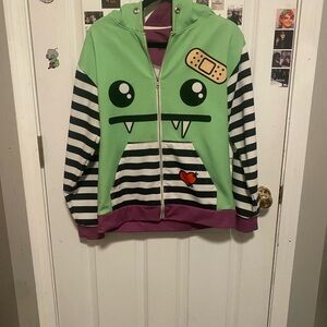 Playful Green Monster Kids Hoodie with Striped Sleeves